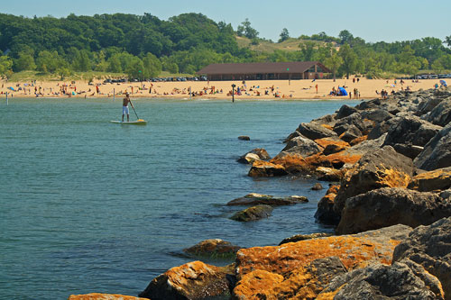 standup paddle boarding on the beach holland state park